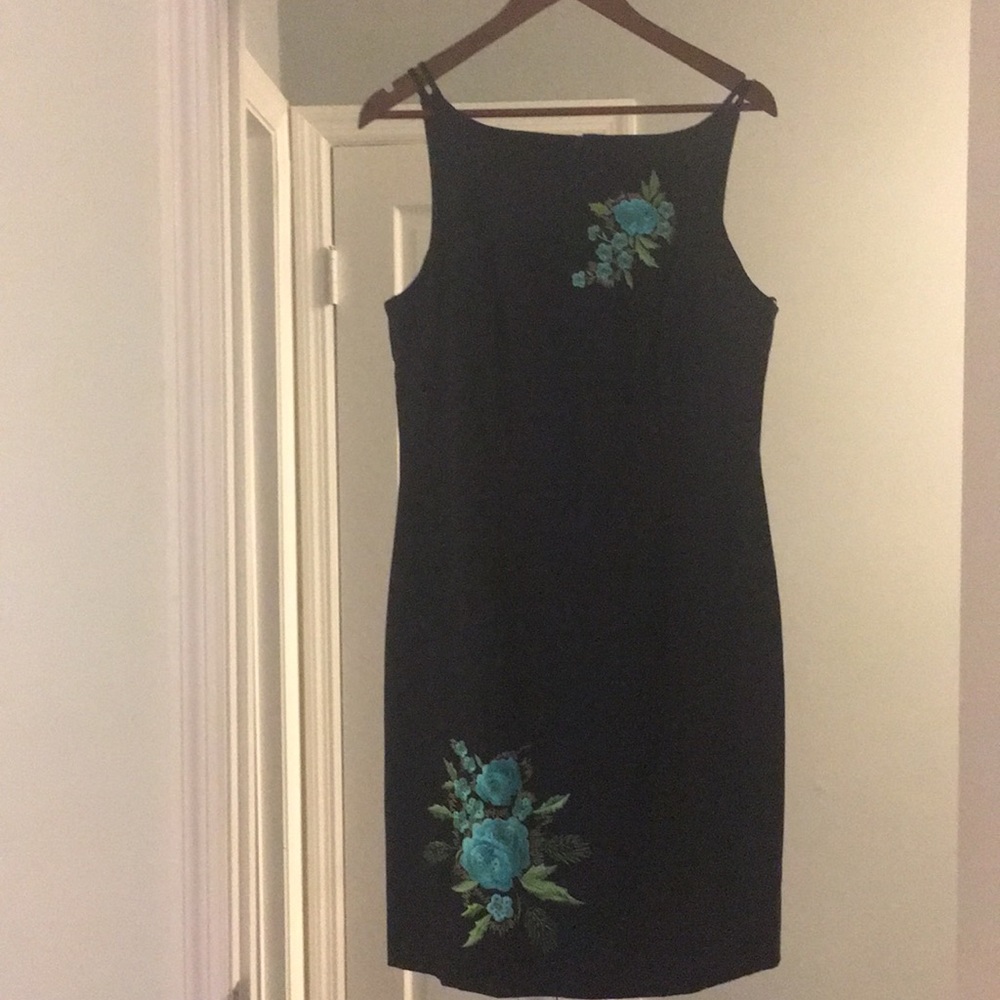 Black dress with floral appliqué